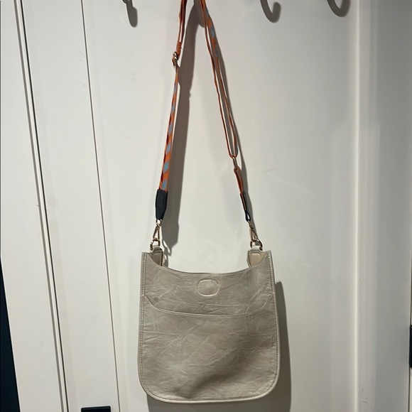 Ahdorned cream cross body bag with orange
Blue & cranberry colored strap. - Picture 1 of 7